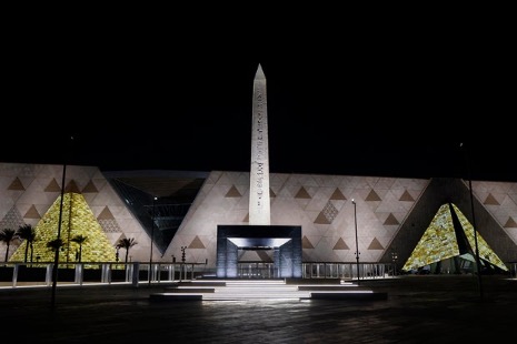 The Obelisk of Ramses II is pictured before the facade and entrance of the new Grand Egyptian Museum in Giza near Cairo 